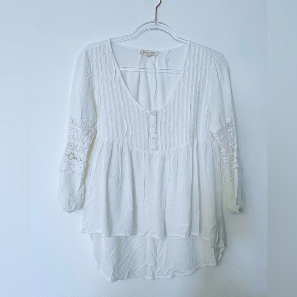 White blouse with lace detail.